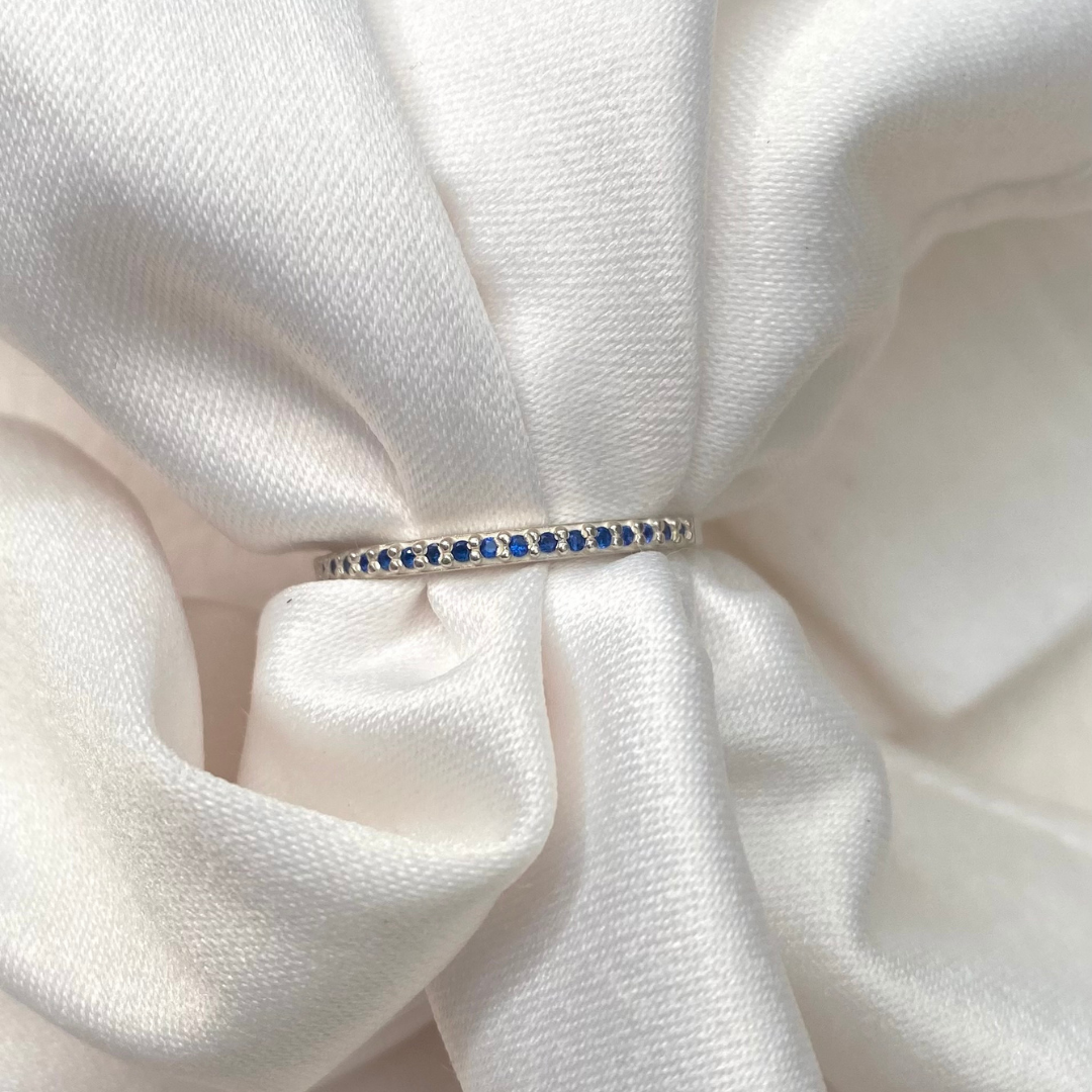 Anel Meia Aliança de Prata 950 com Zircônia Azul